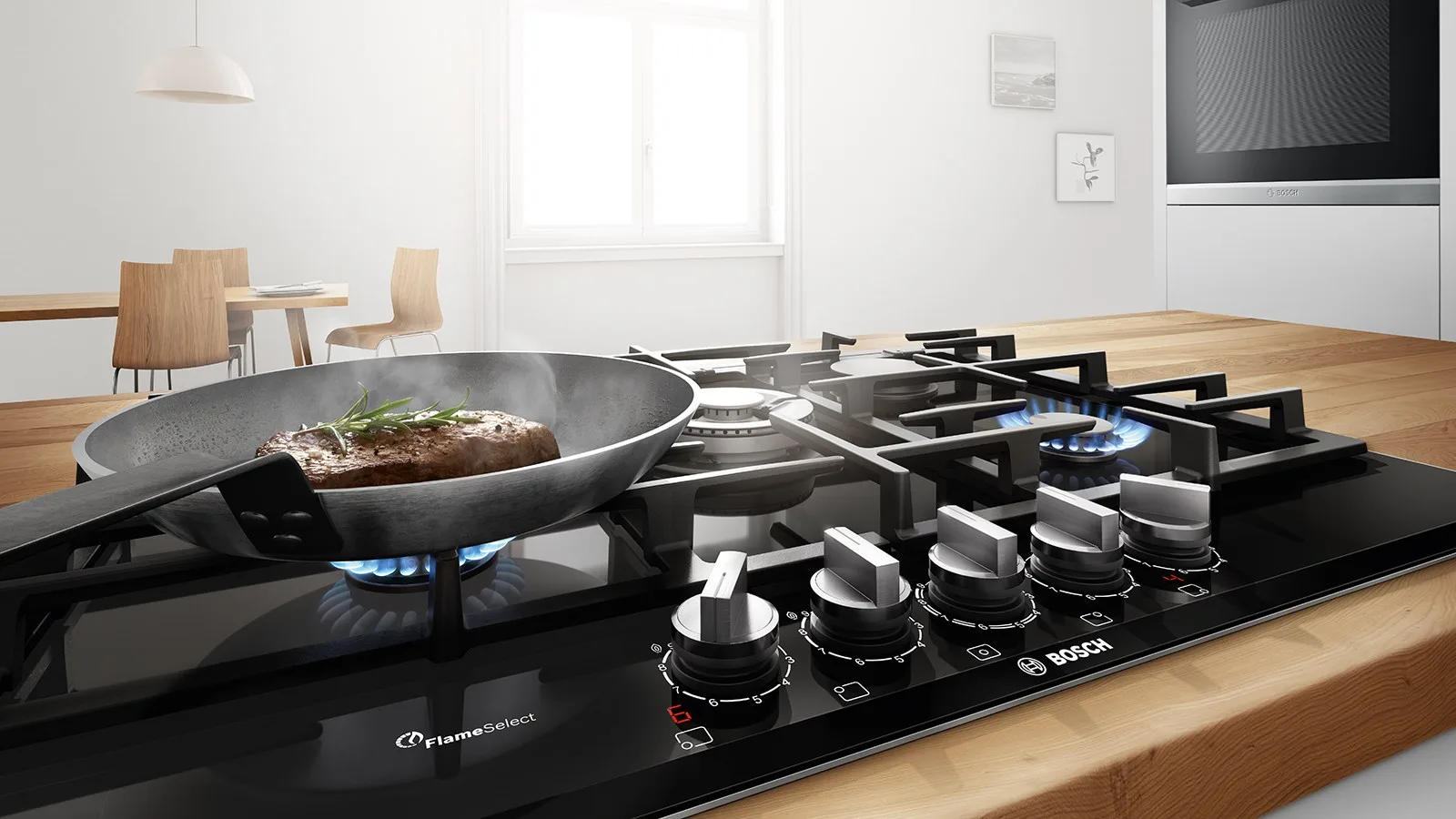 Gas hob with cast iron pan supports in use