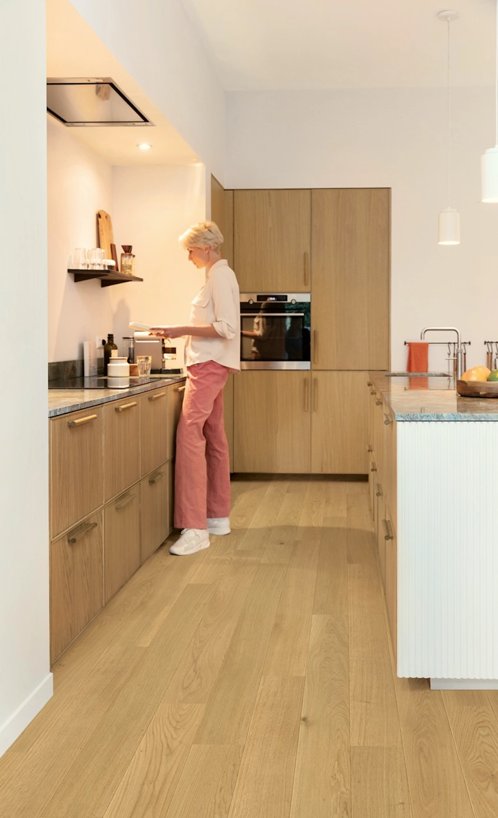Oak slab kitchen with tall integrated appliance housing