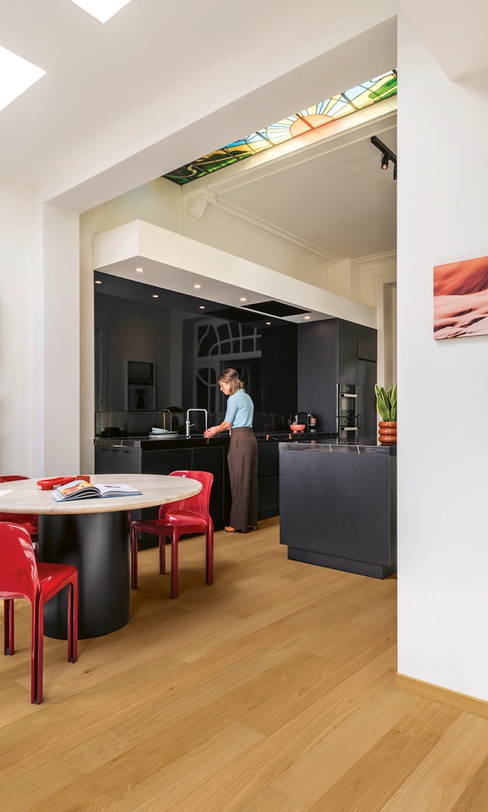 Open plan handleless kitchen with dining area and oak flooring