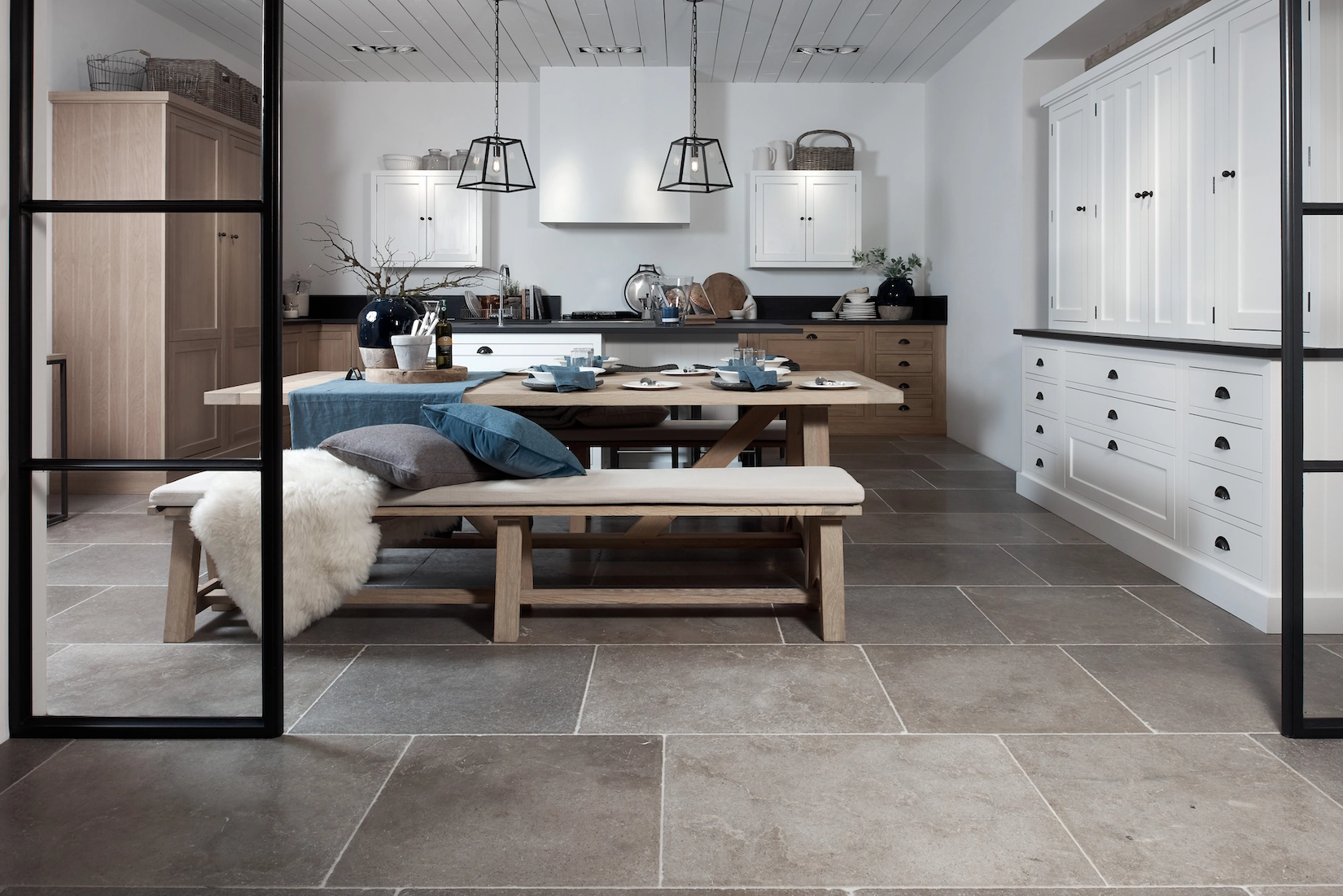 Shaker kitchen with dining bench and large format stone flooring