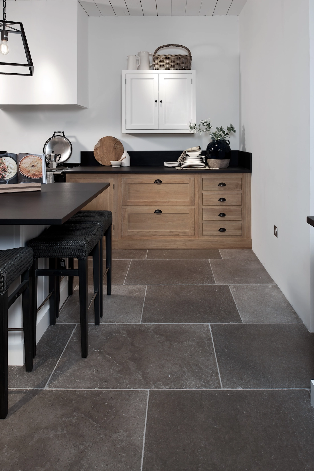 Timber shaker kitchen with dining table and flagstone floor