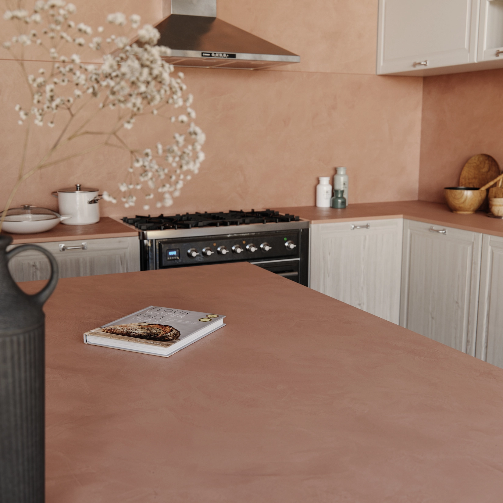 Shaker kitchen with terracotta worktop and range cooker