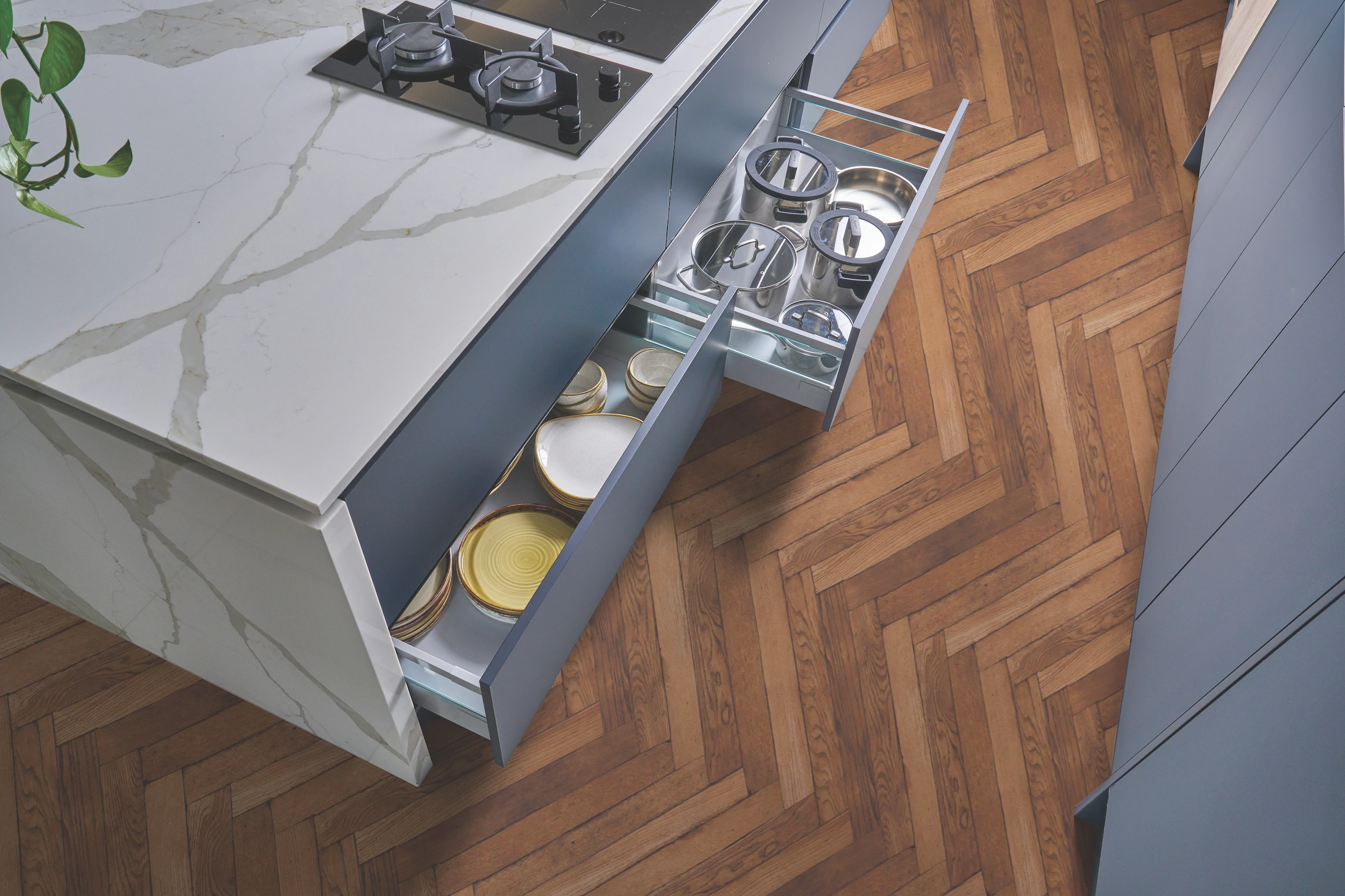 Fitted drawer interior beneath a white marble worktop