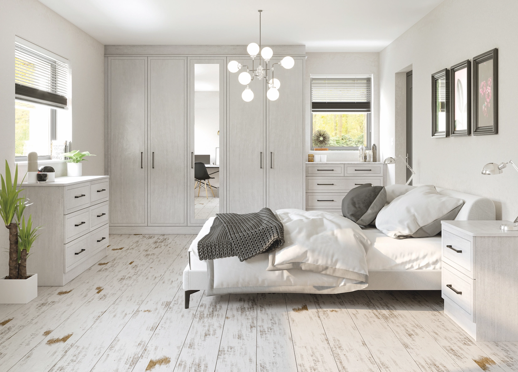 White fitted wardrobes with dressing table and chandelier