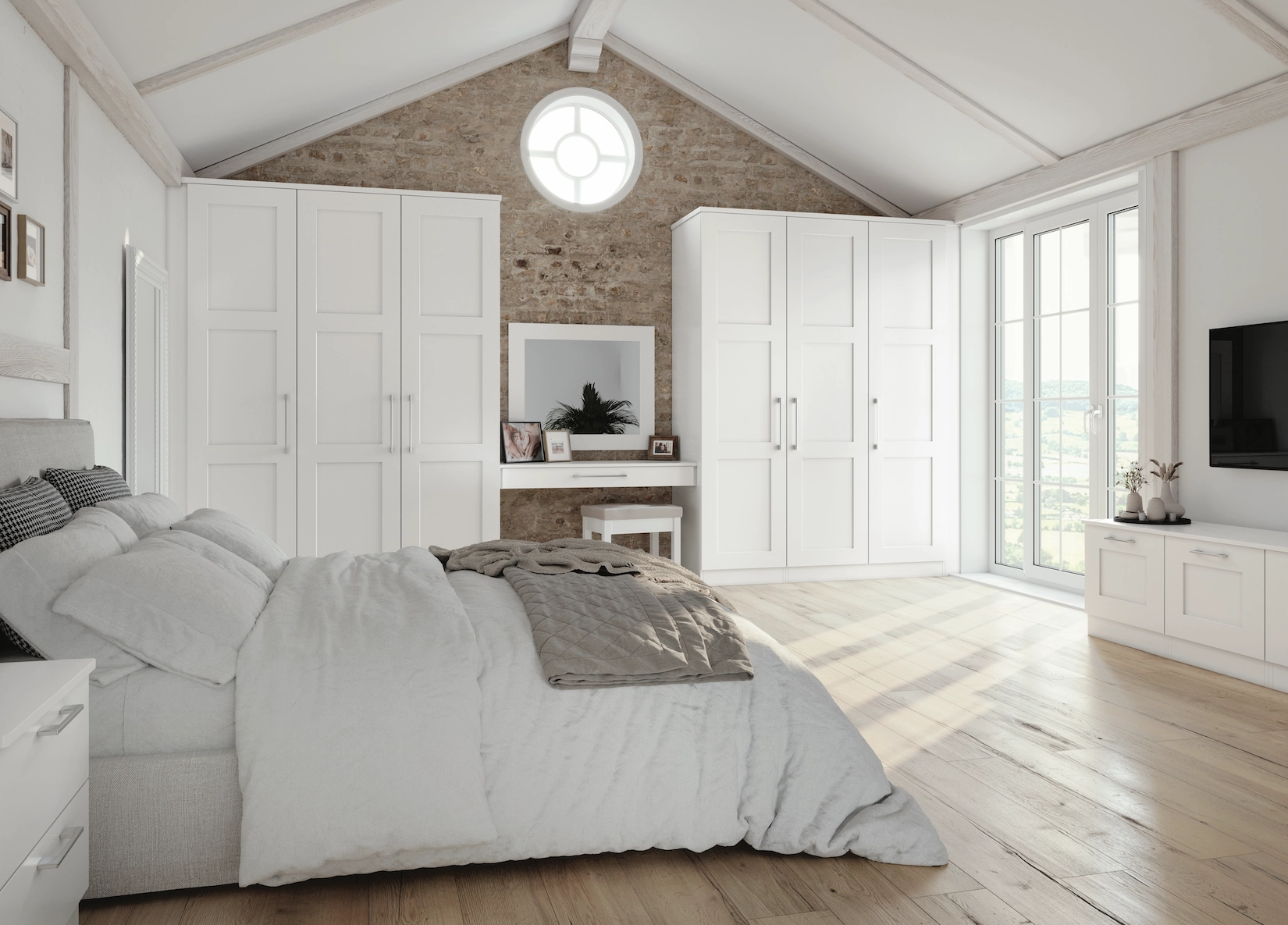 White fitted wardrobes in a vaulted bedroom with roof windows