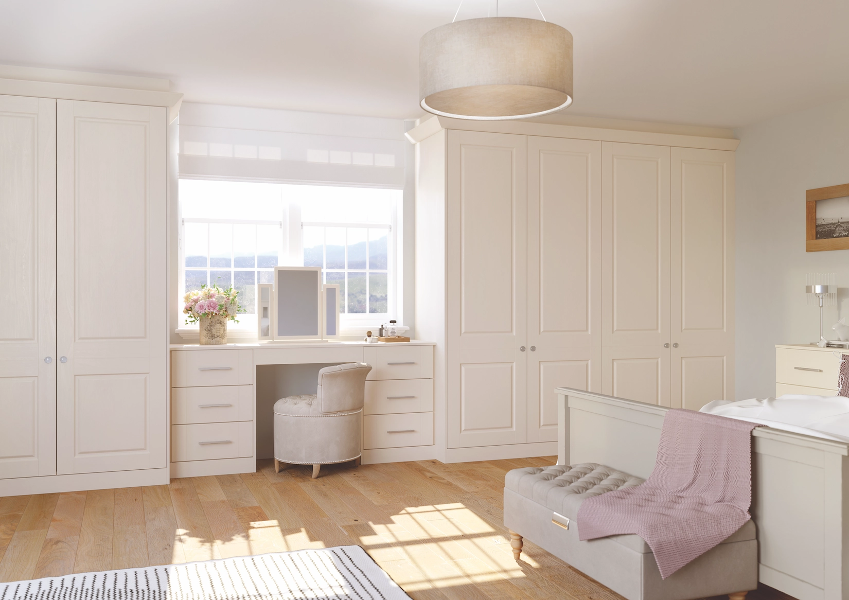 Cream fitted wardrobes with dressing table and window seat