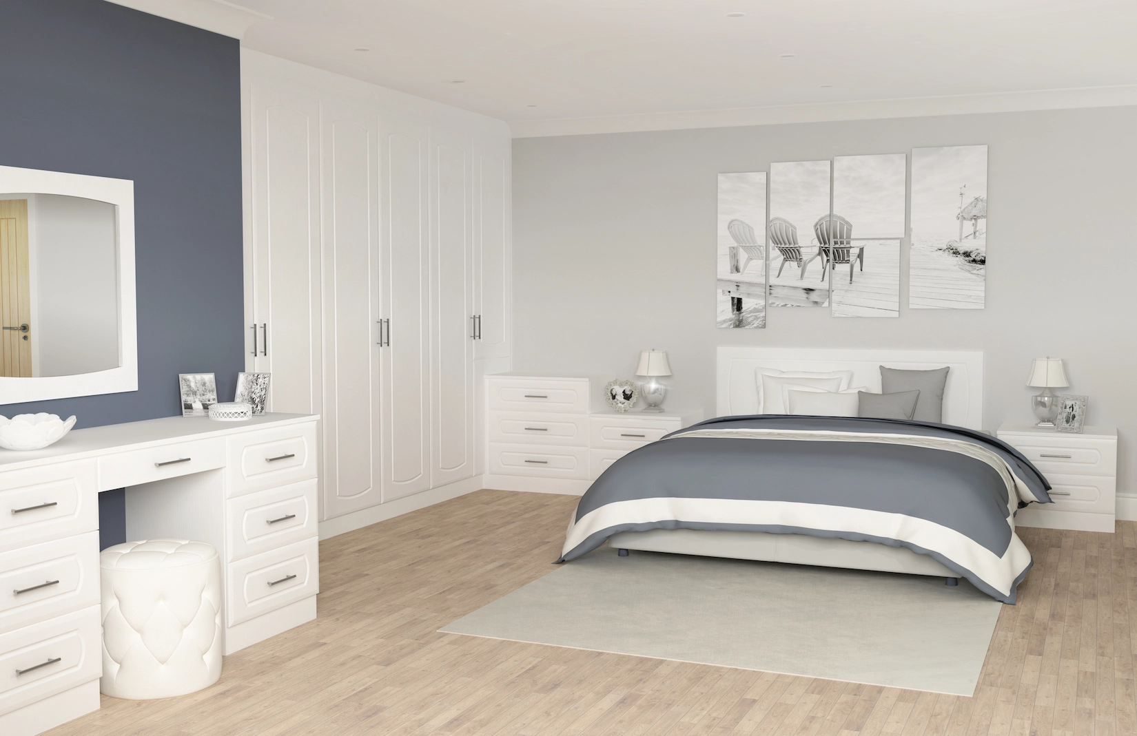 White fitted wardrobes with dressing table and navy feature wall