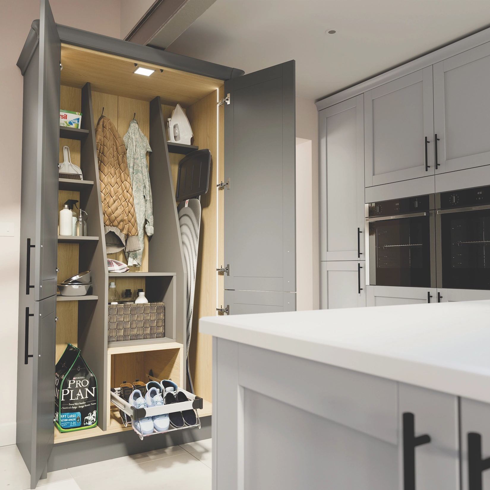 Fitted utility larder with pull-out shelving and hanging rail