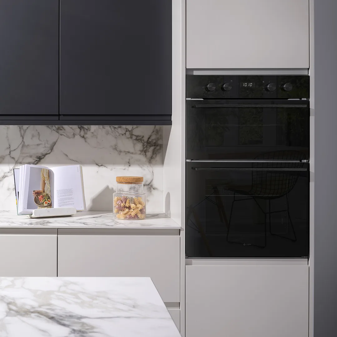 Built-in double oven in matt graphite within a cream kitchen