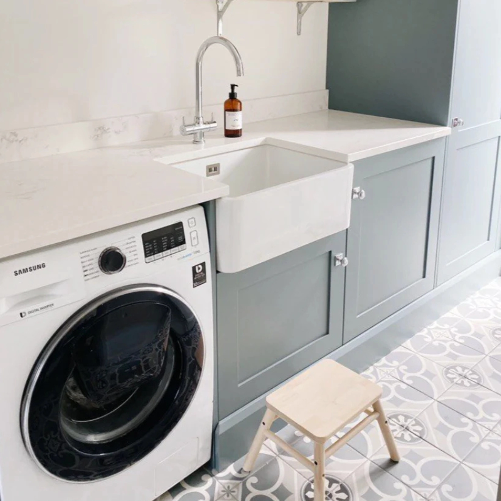 Utility room with integrated washing machine and butler sink