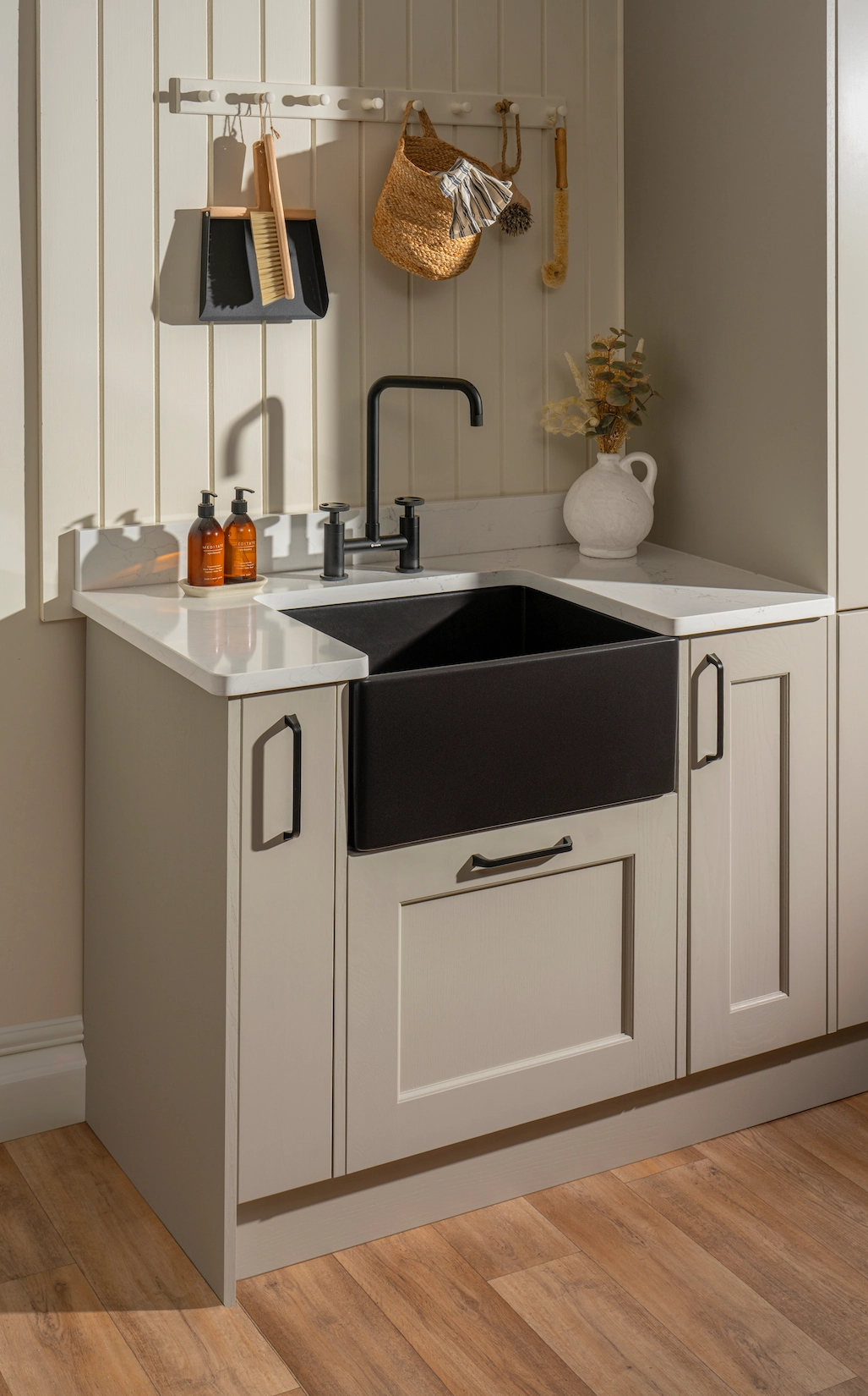 Compact utility with black ceramic sink and brass fittings