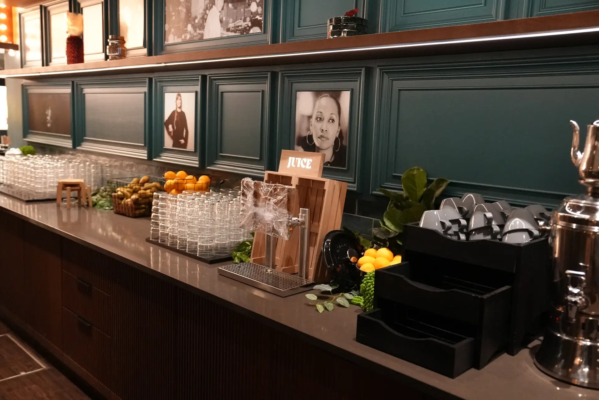 Dark green panelled bar counter with copper detailing
