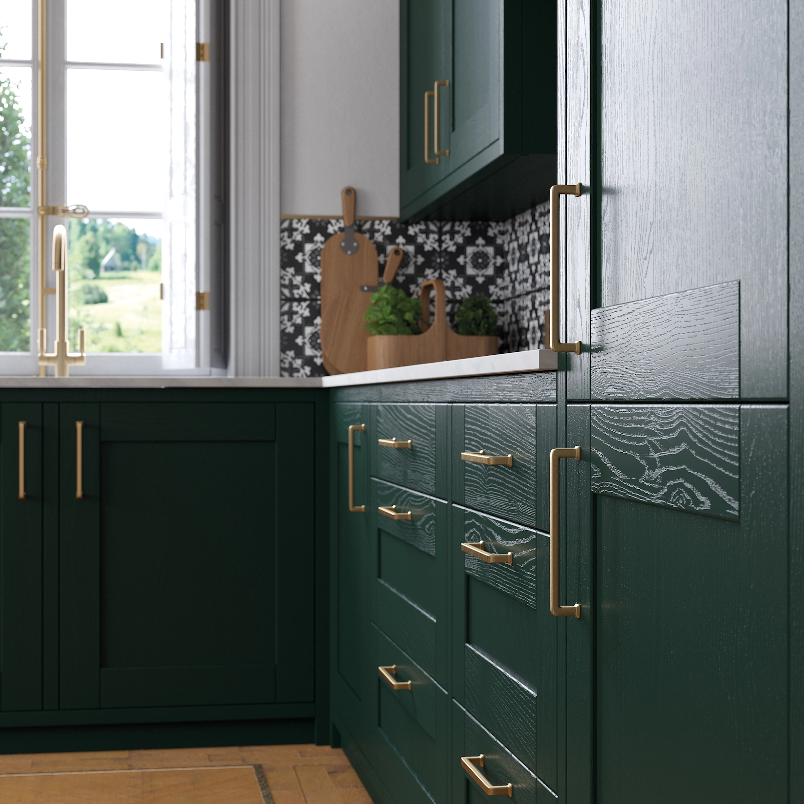Dark green shaker cabinets with brass handles and patterned tiles
