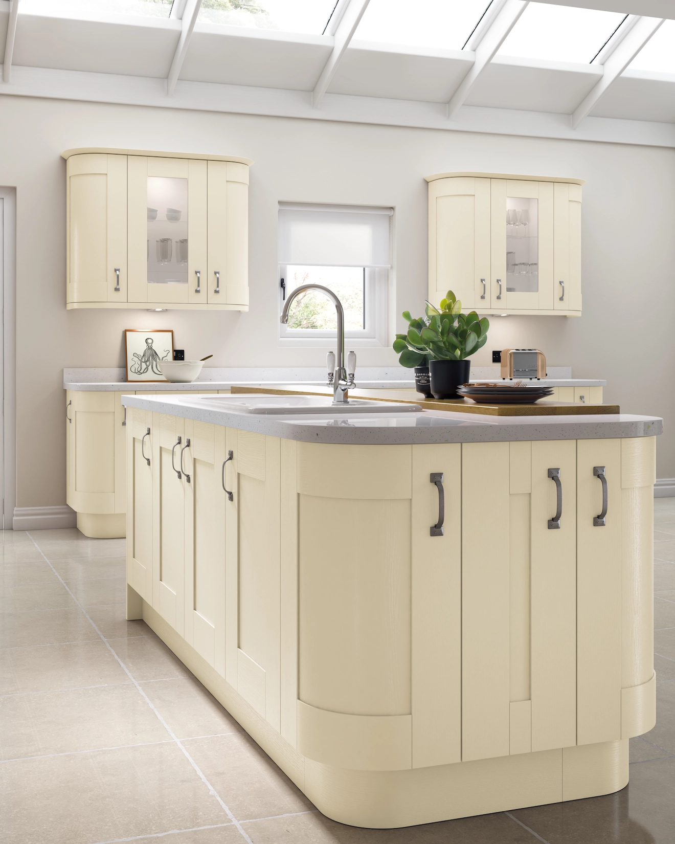 Cream shaker kitchen with curved island and glazed wall units