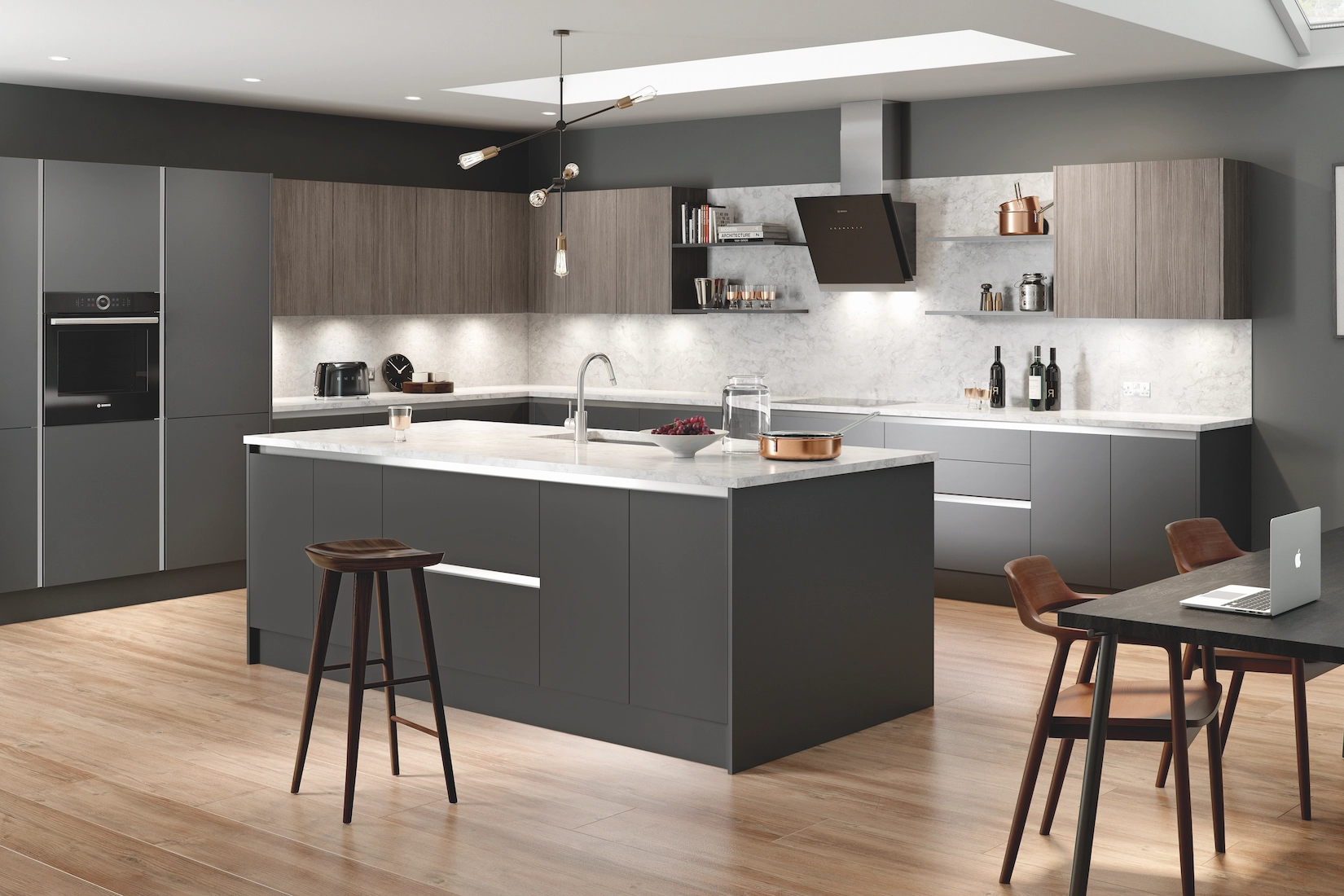 Grey handleless kitchen with island seating and oak flooring
