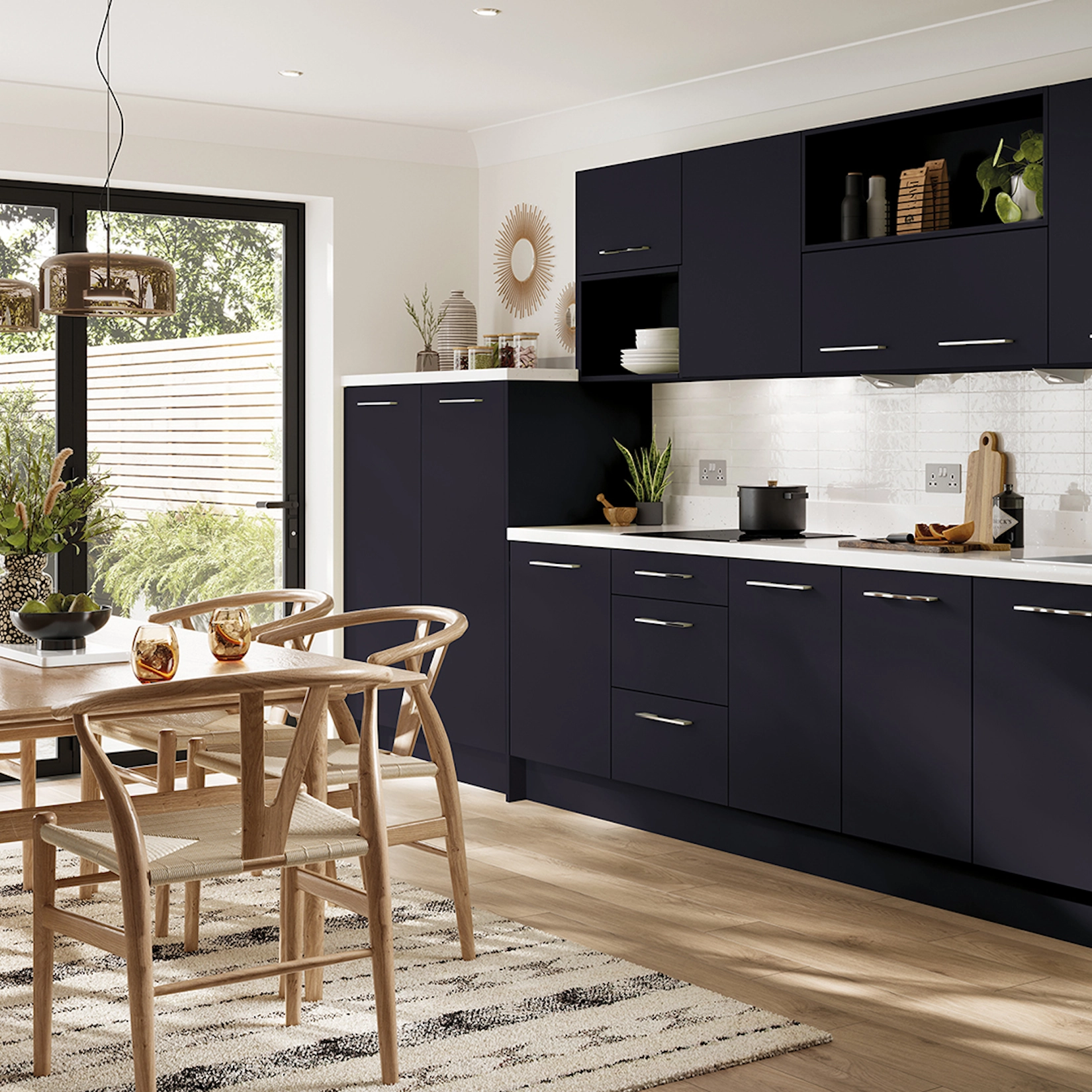 Navy slab kitchen with dining table and open shelving