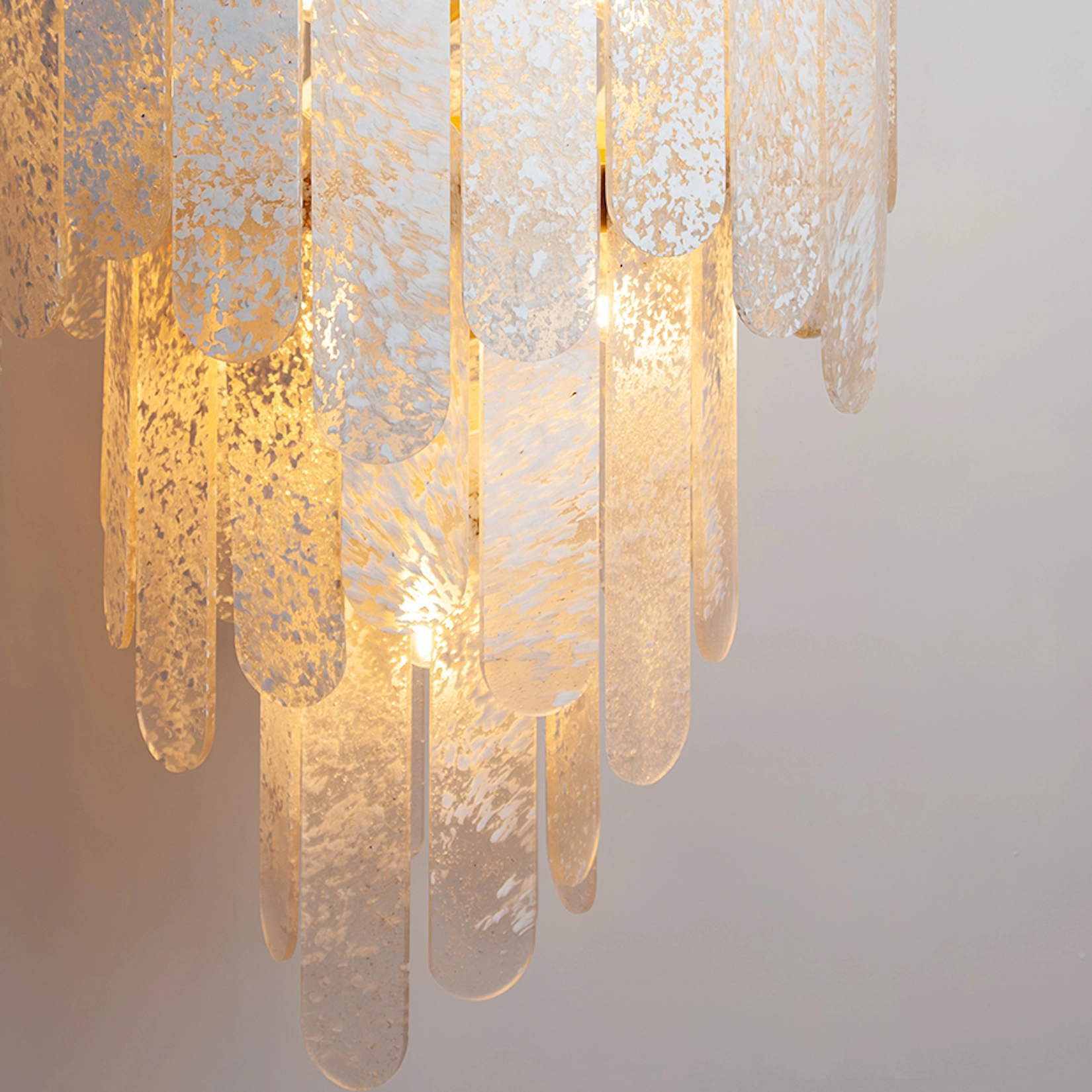 Textured glass chandelier with warm lighting