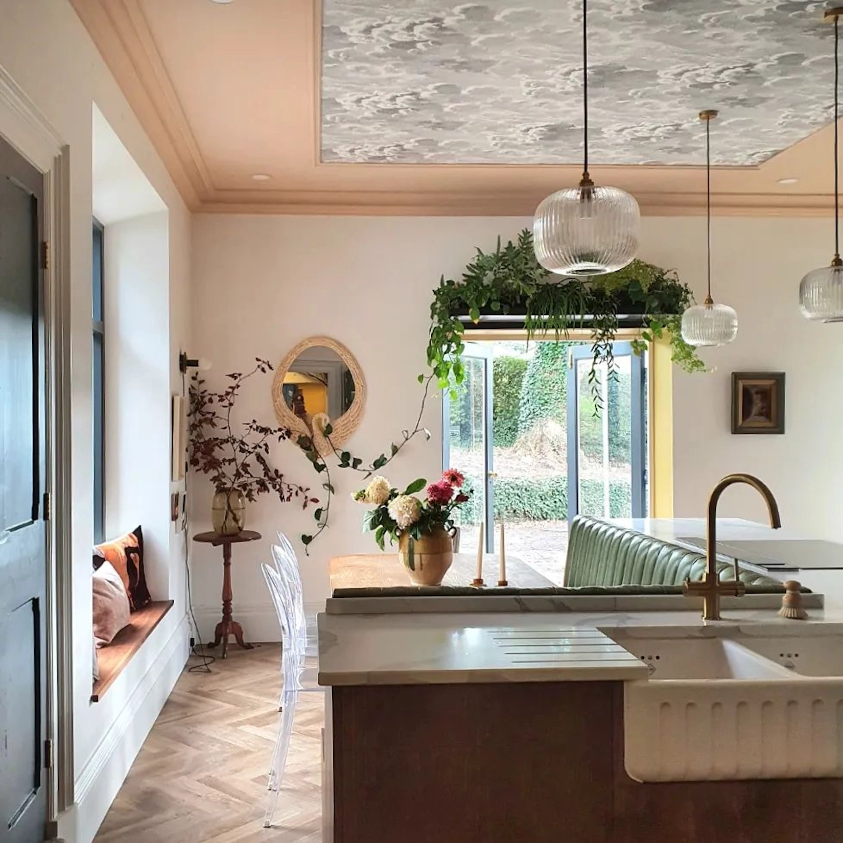 Kitchen with copper island, butler sink and patterned ceiling