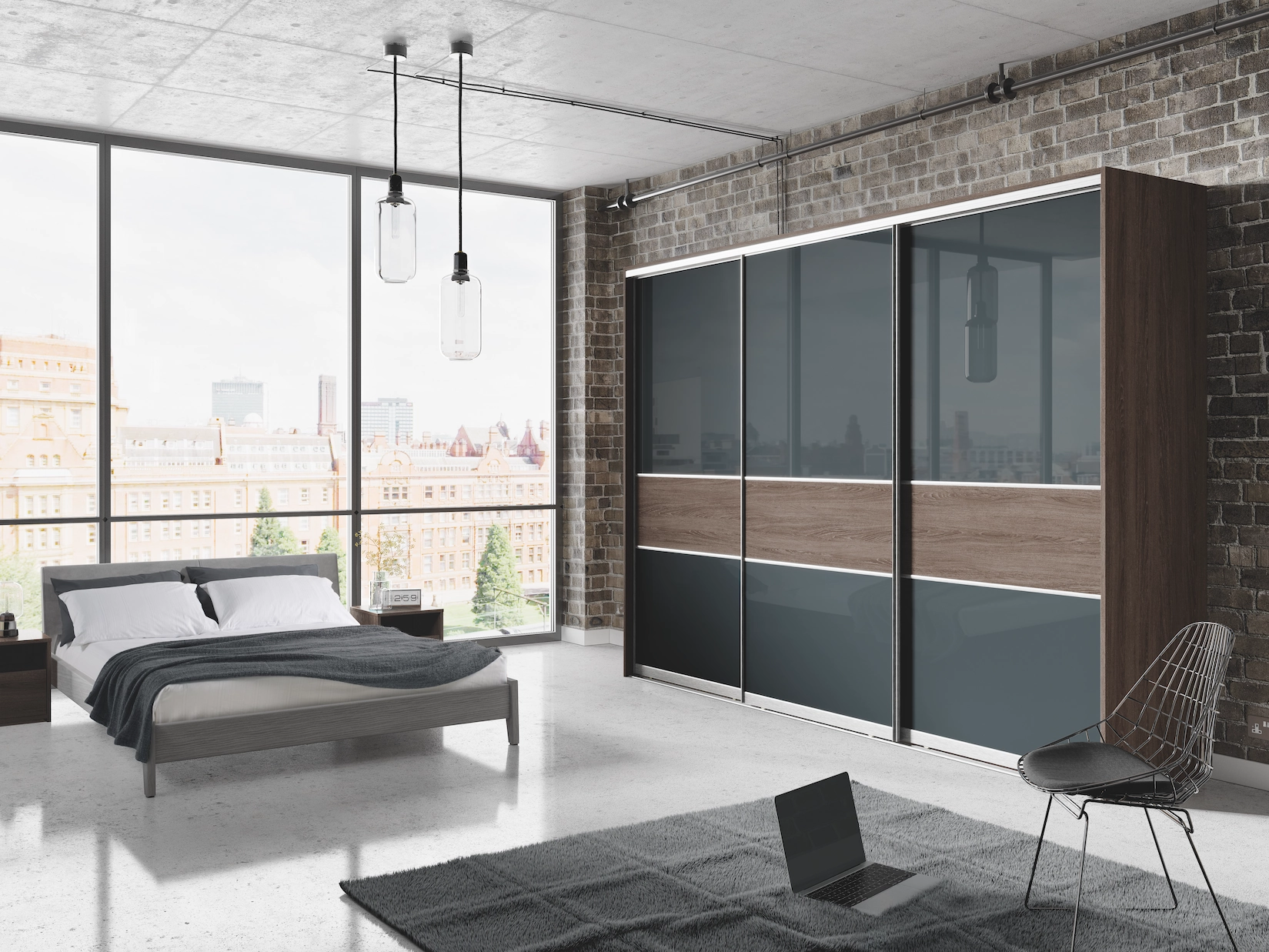 Sliding wardrobe doors in grey glass and timber in a loft bedroom