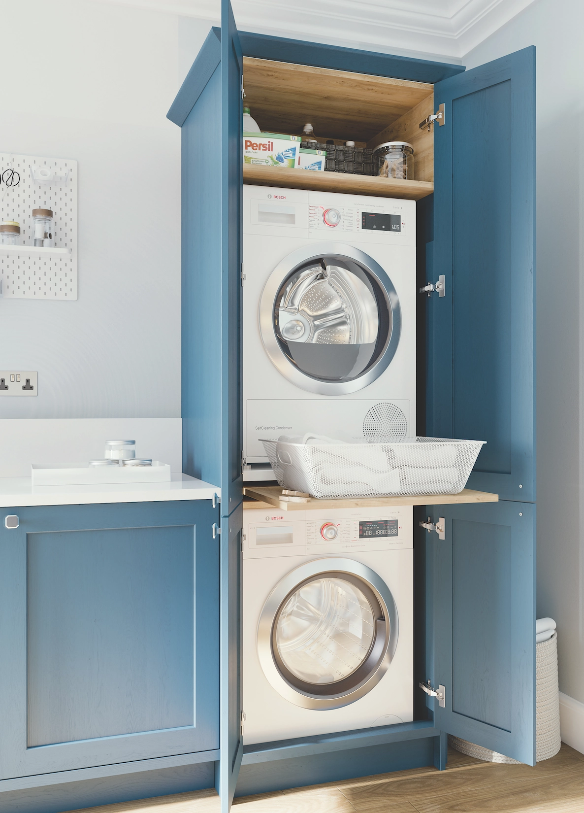 Blue utility cupboard with stacked washer and dryer