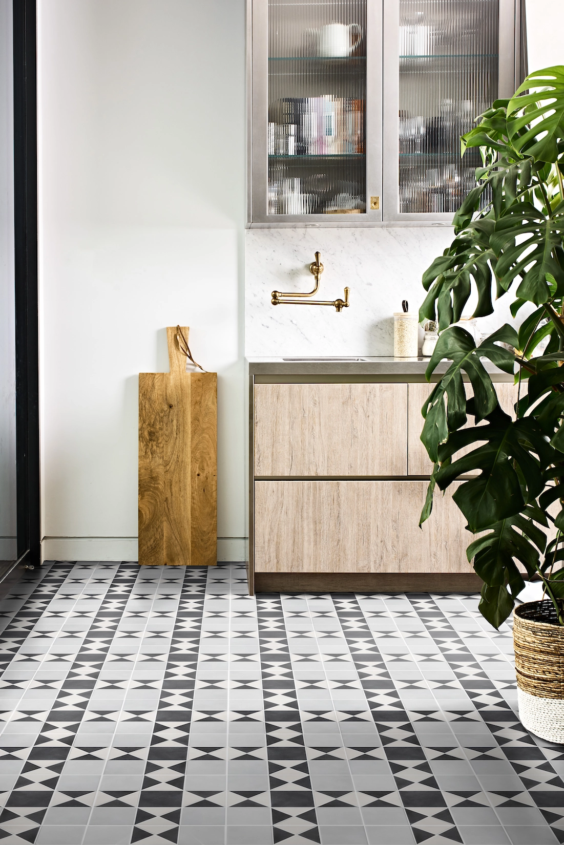 Utility room with timber vanity and patterned floor tiles