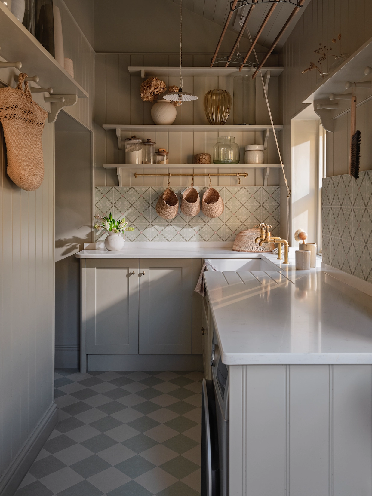 Galley utility room with hanging rail and chequerboard floor