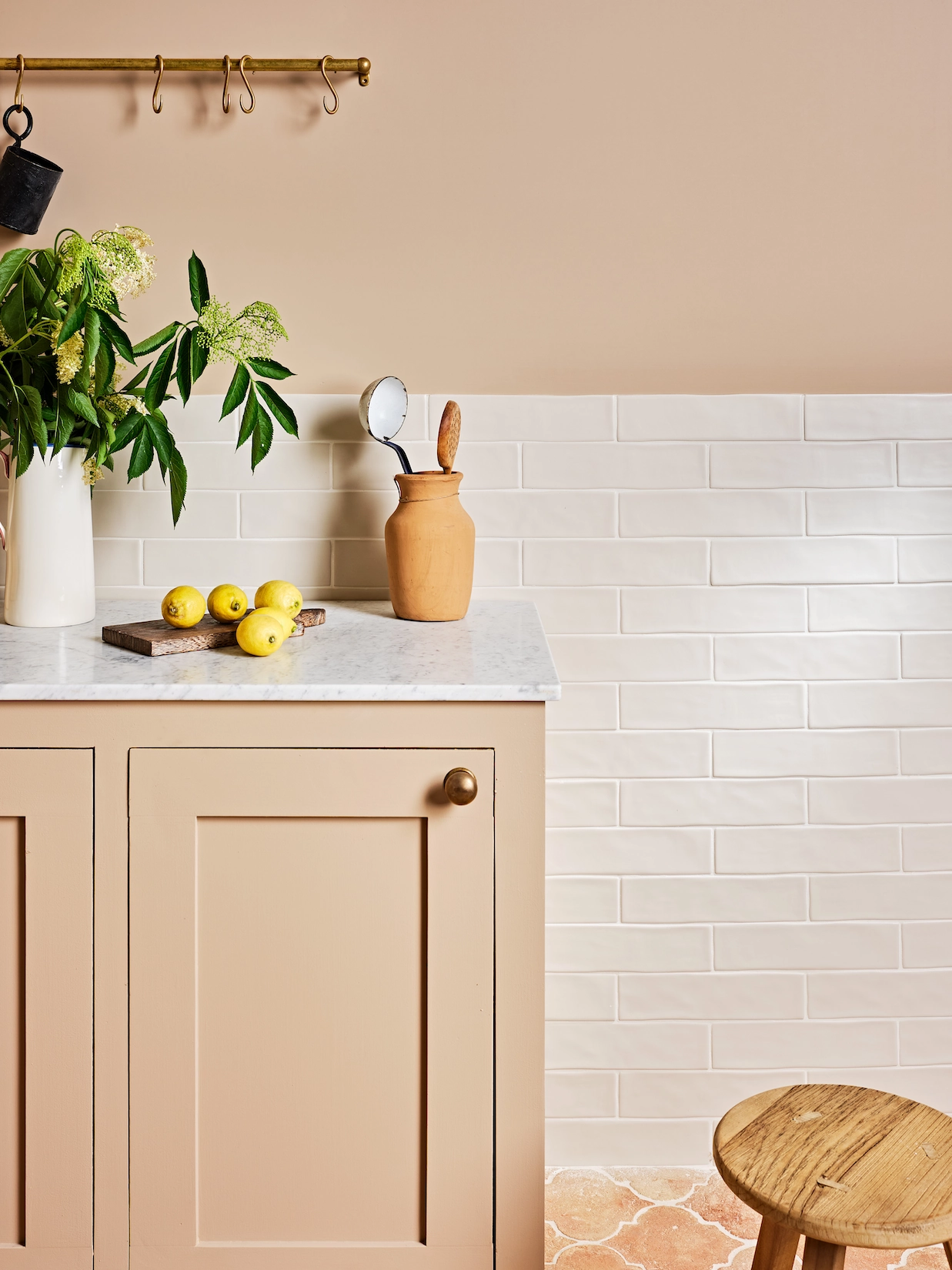 Blush utility cabinets with metro tile splashback