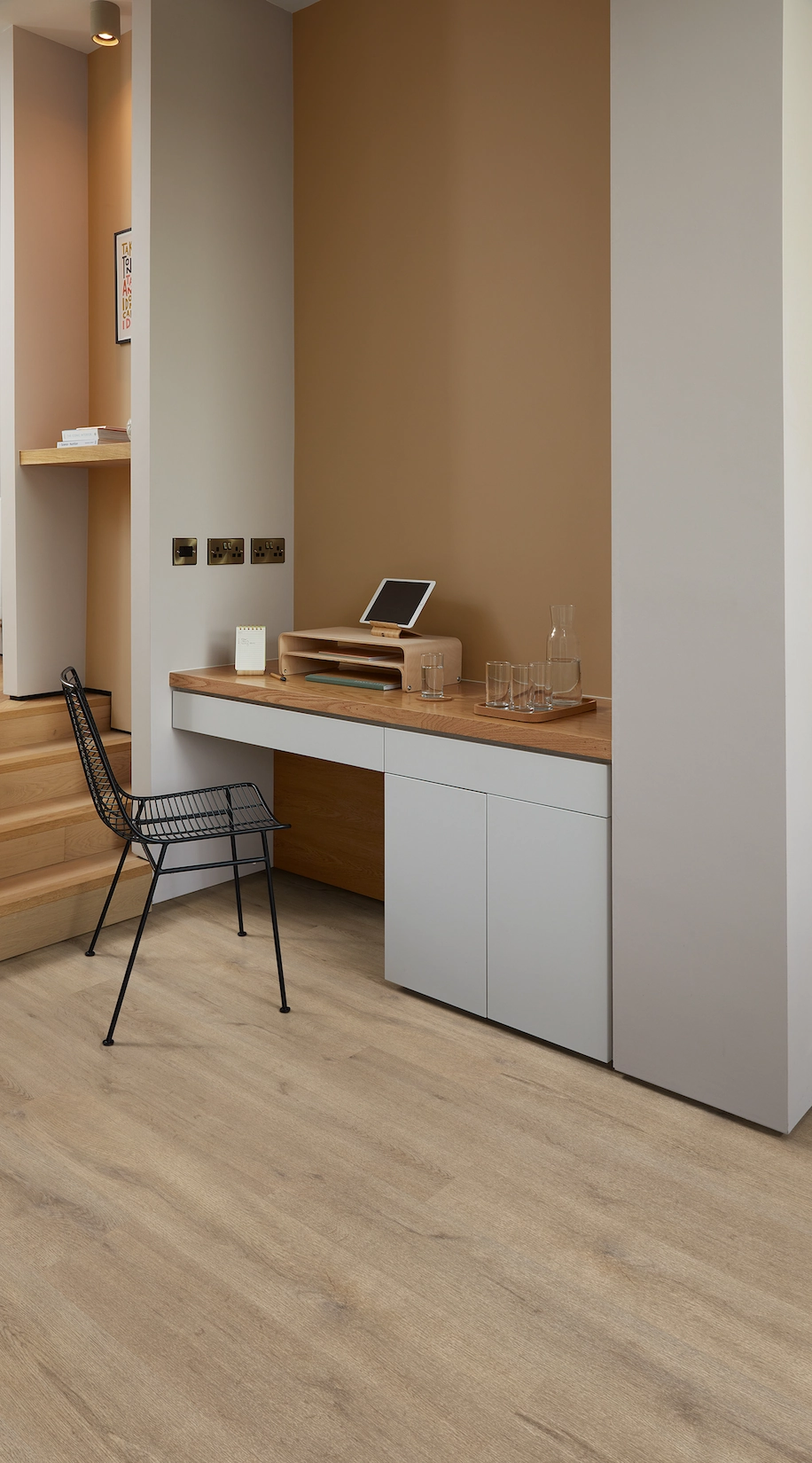 Compact home office nook with fitted desk and shelving