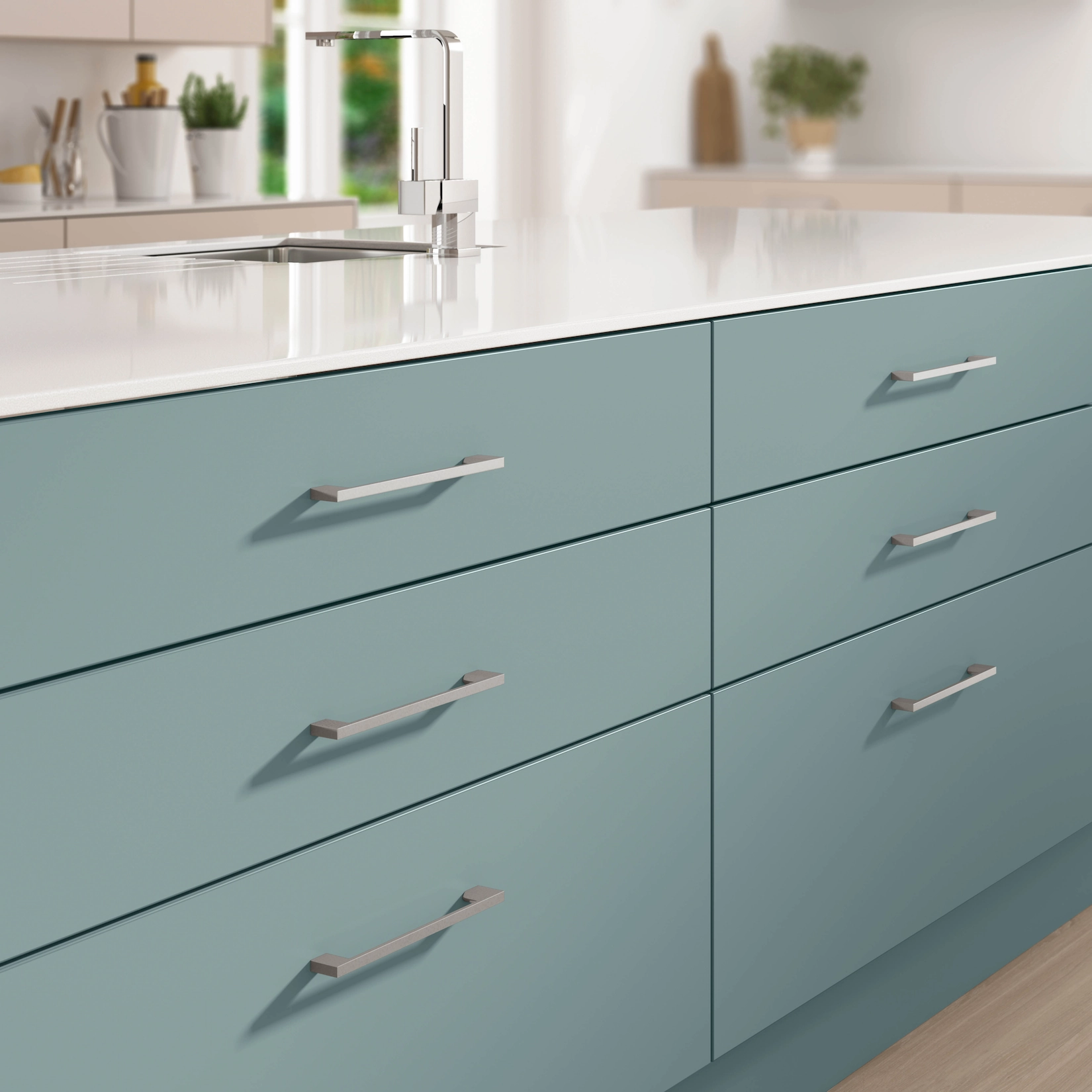 Teal slab drawers with brushed steel handles