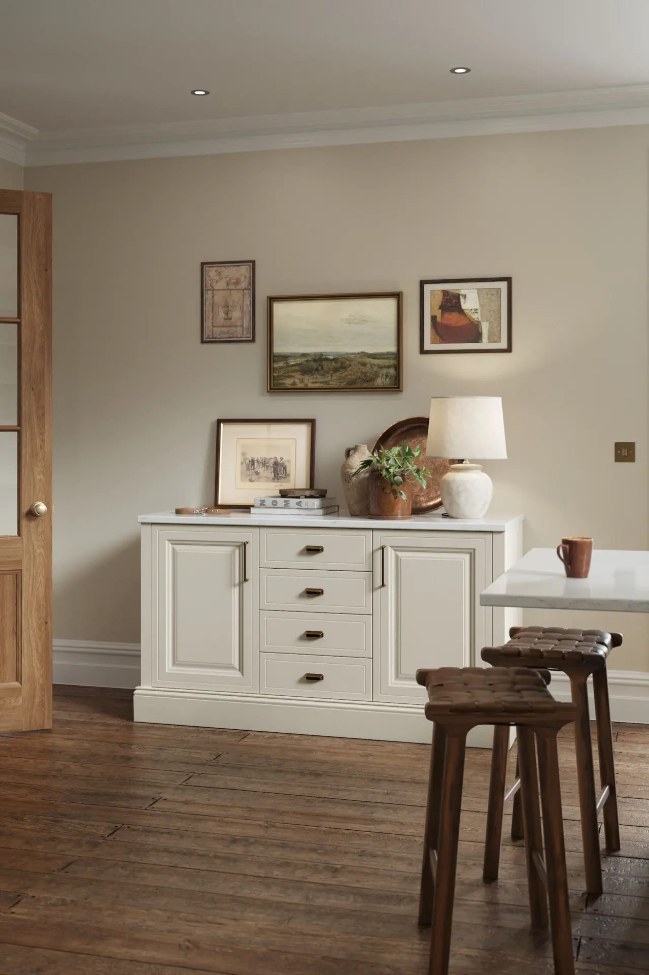 Cream sideboard with artwork and timber stools