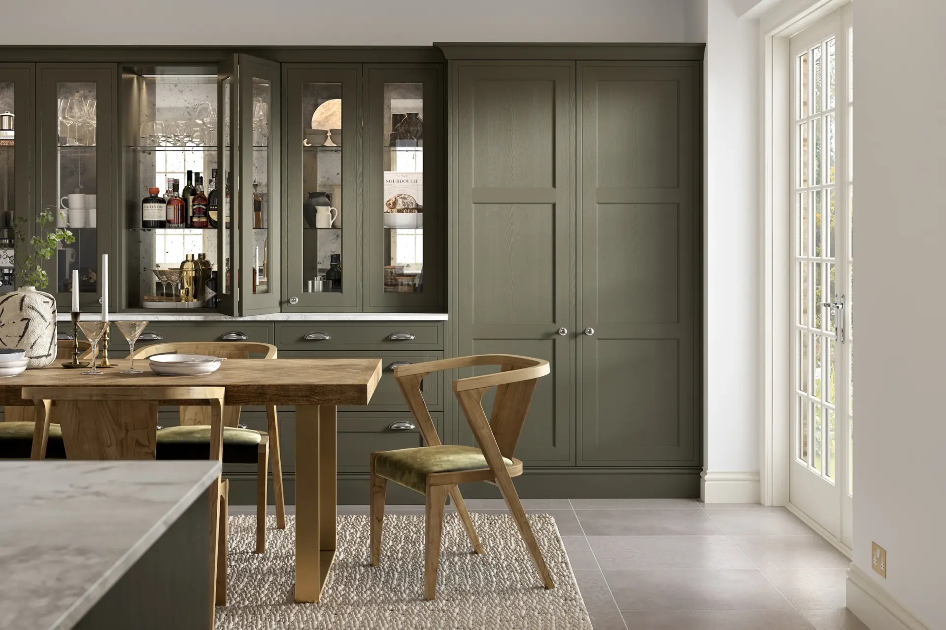 Green dresser and dining table in an open plan space