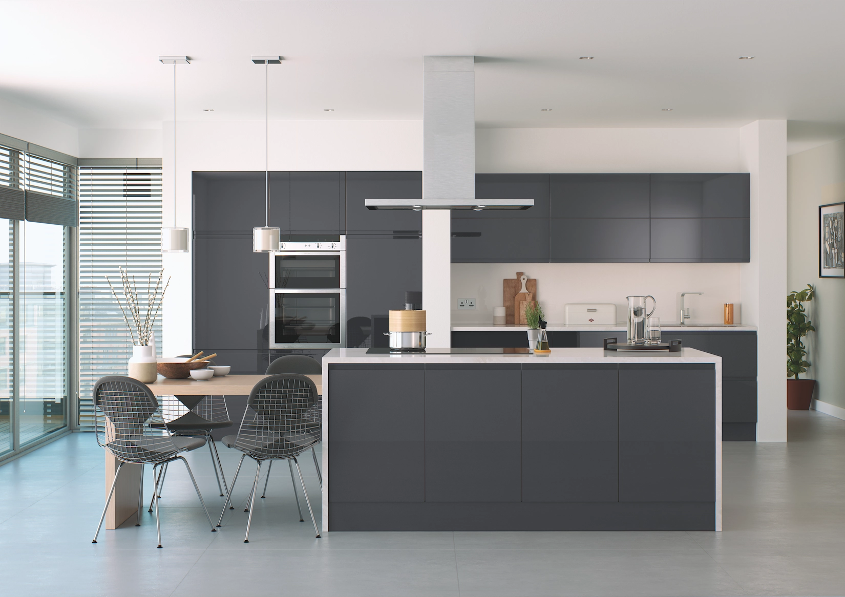 Grey handleless kitchen with island extractor and dining area