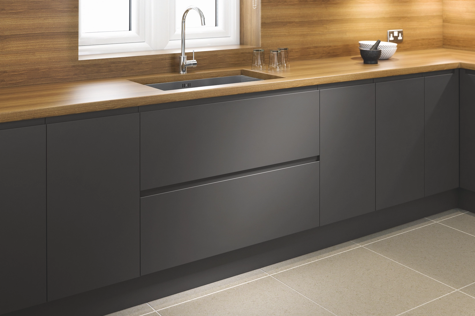 Dark grey handleless kitchen run with oak worktop