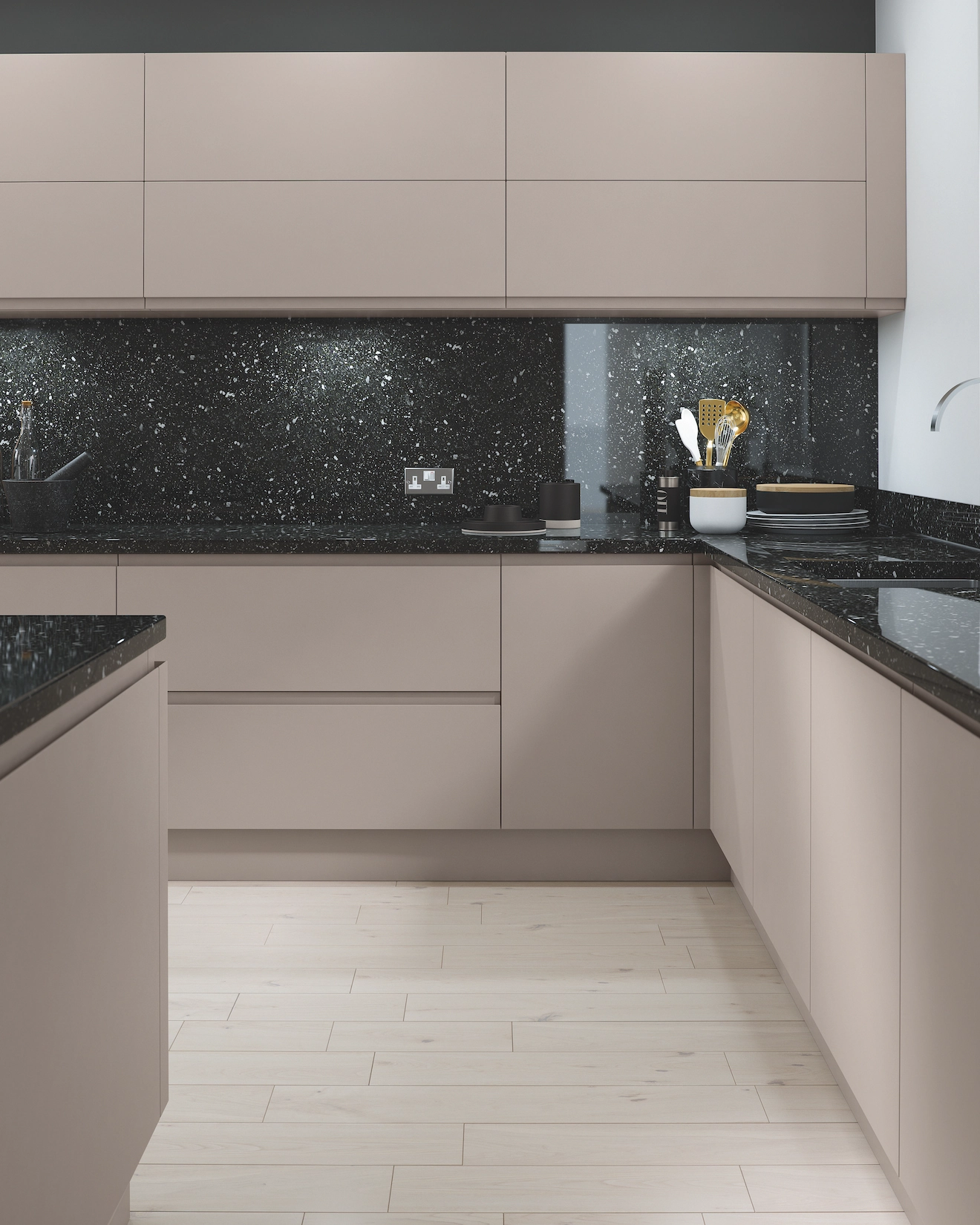 Handleless kitchen in stone with black granite worktop