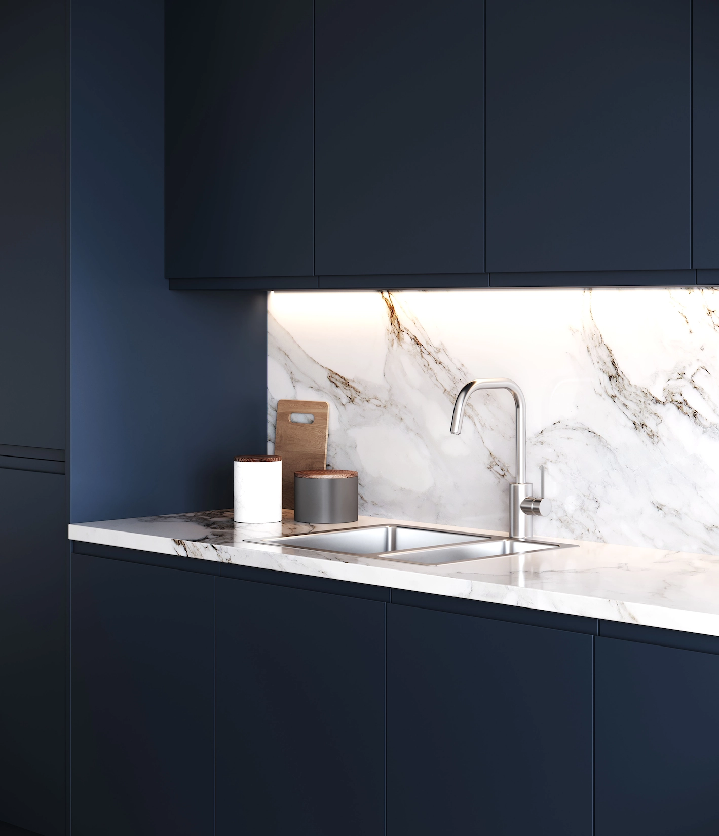Navy handleless kitchen with marble splashback