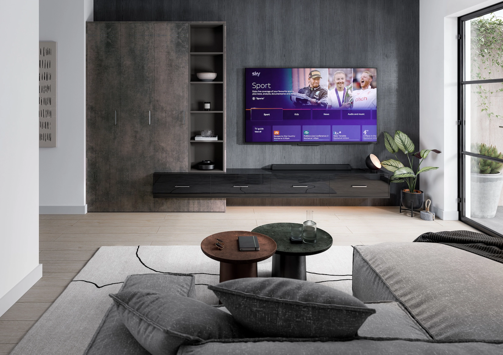 Media wall with wall-mounted television and integrated speakers