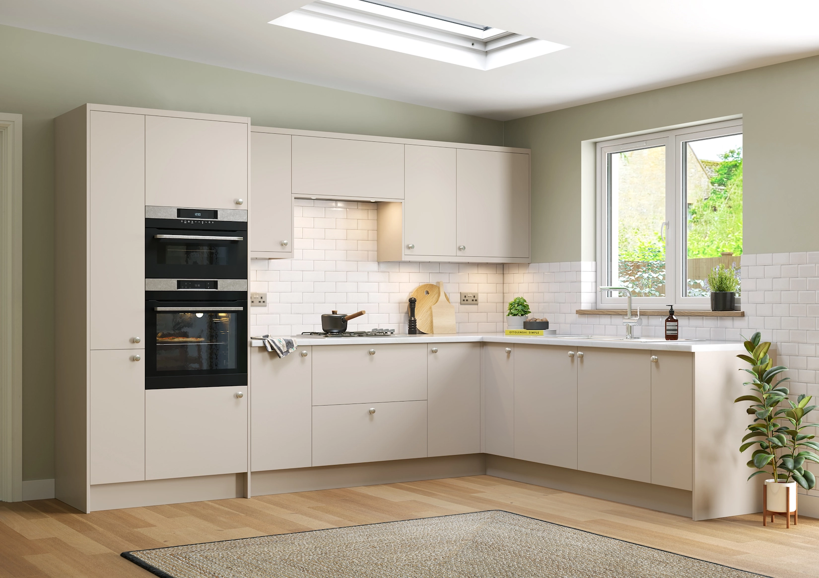 Cream slab kitchen with integrated ovens and roof lantern