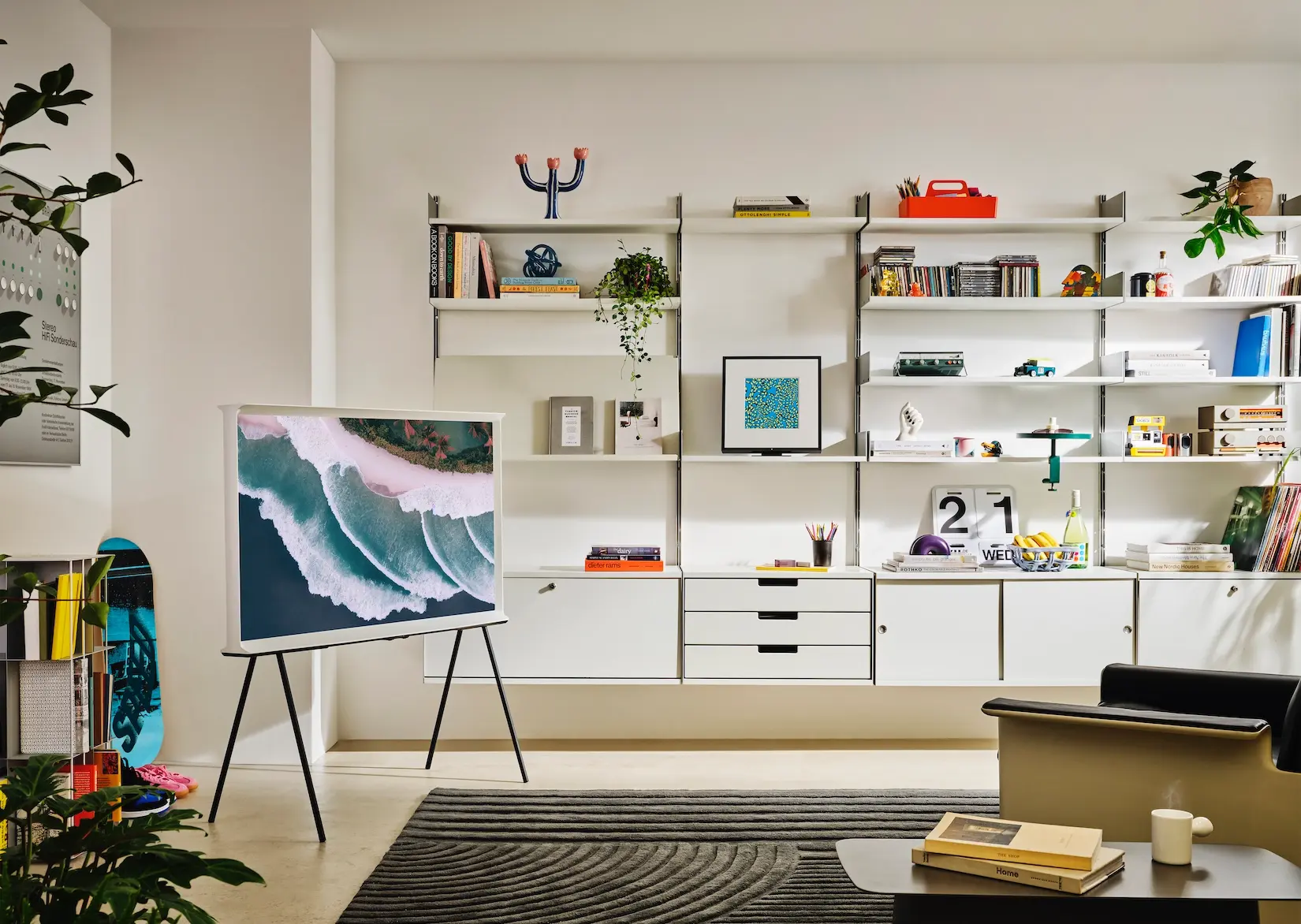 Modular shelving wall with television and artwork display