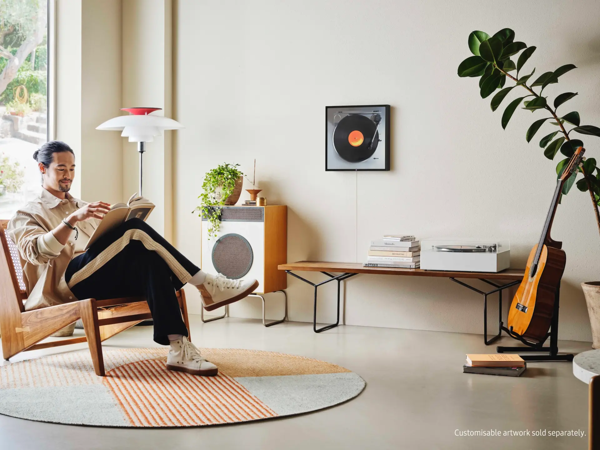 Living space with record player, armchair and shelving
