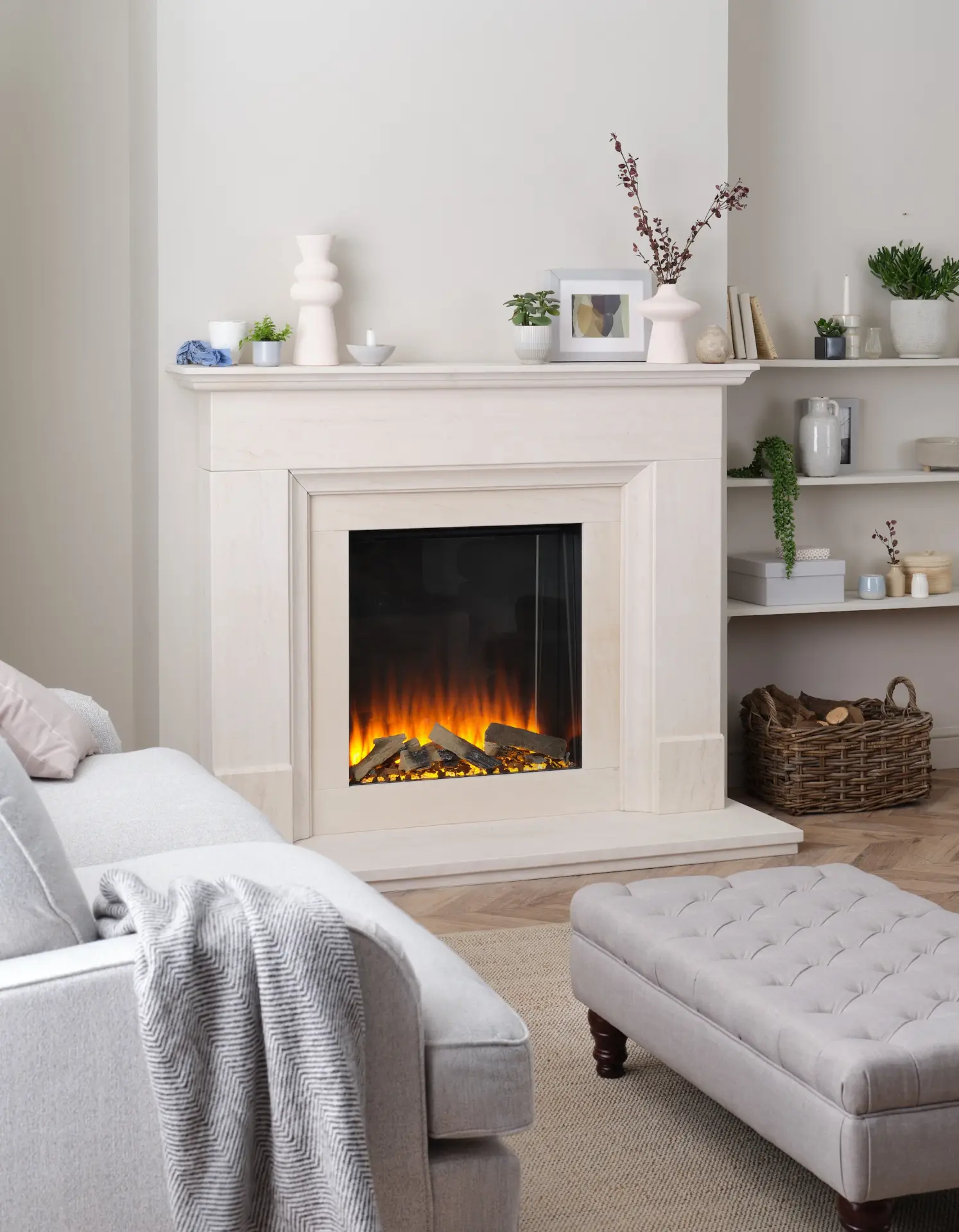 Living room with marble fireplace and fitted alcove shelves