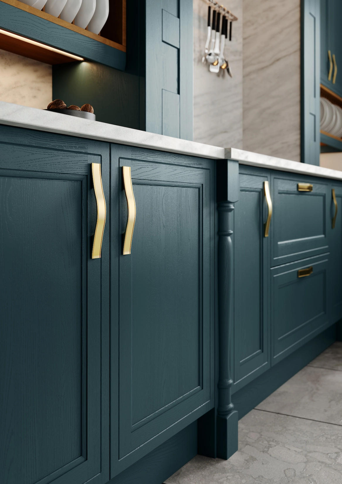 Dark teal shaker cabinets with brass bar handles