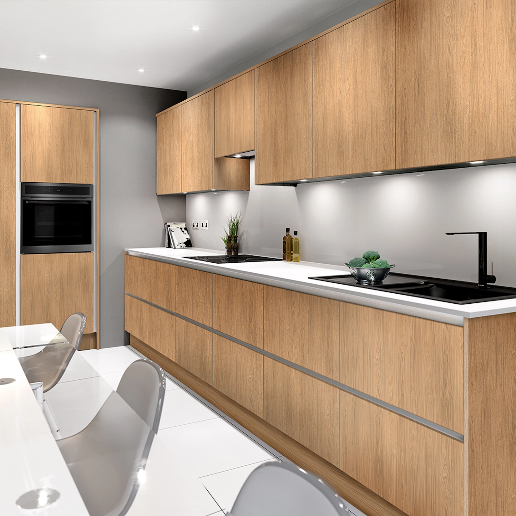 Oak handleless kitchen with island and integrated ovens
