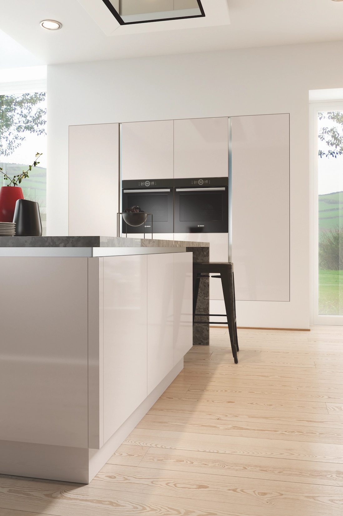 Stone coloured handleless kitchen with island seating