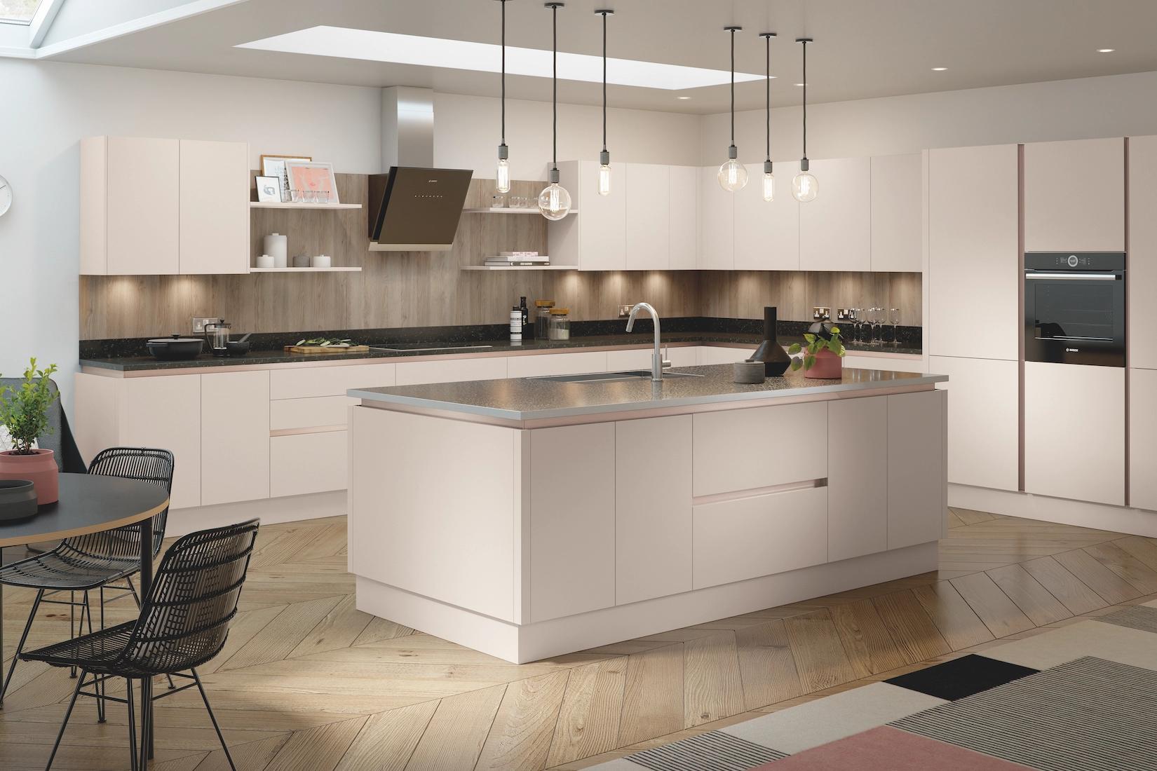 Handleless kitchen in stone with island and pendant lights