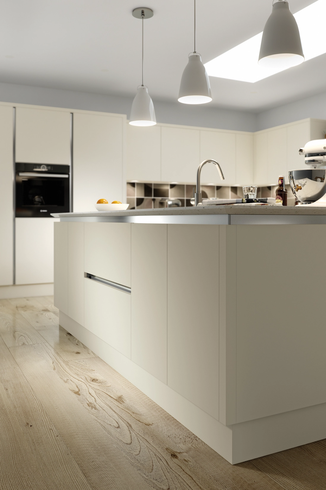 Cream handleless kitchen island with pendant lighting