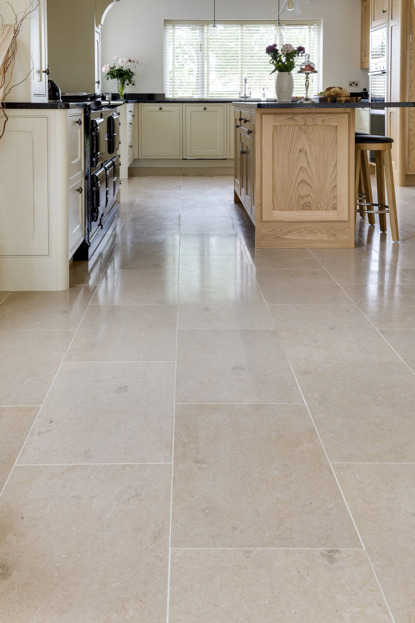 Cream shaker kitchen with range cooker and stone flooring