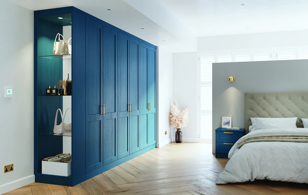 Fitted bedroom wardrobes in blue with open dressing area