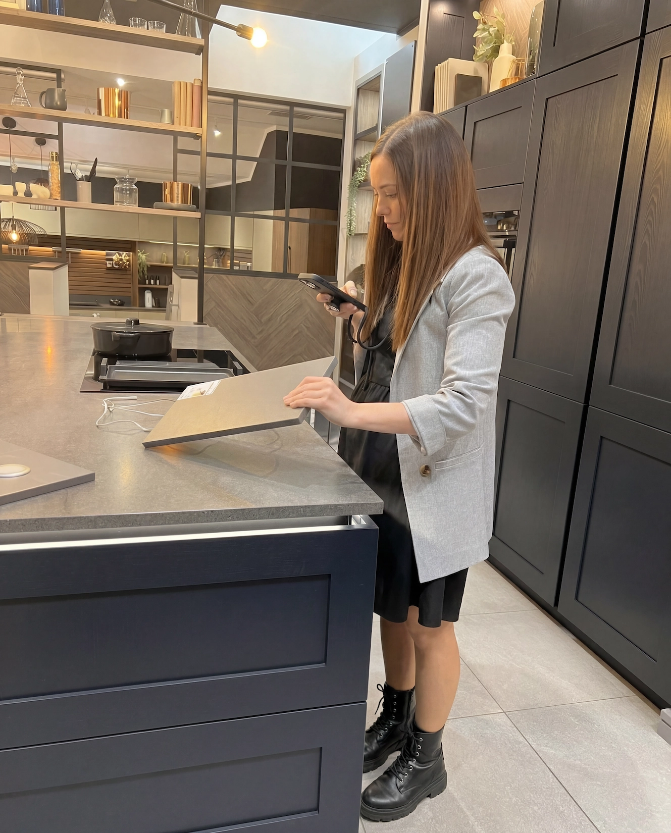 Hope Kitchens designer working at a kitchen island
