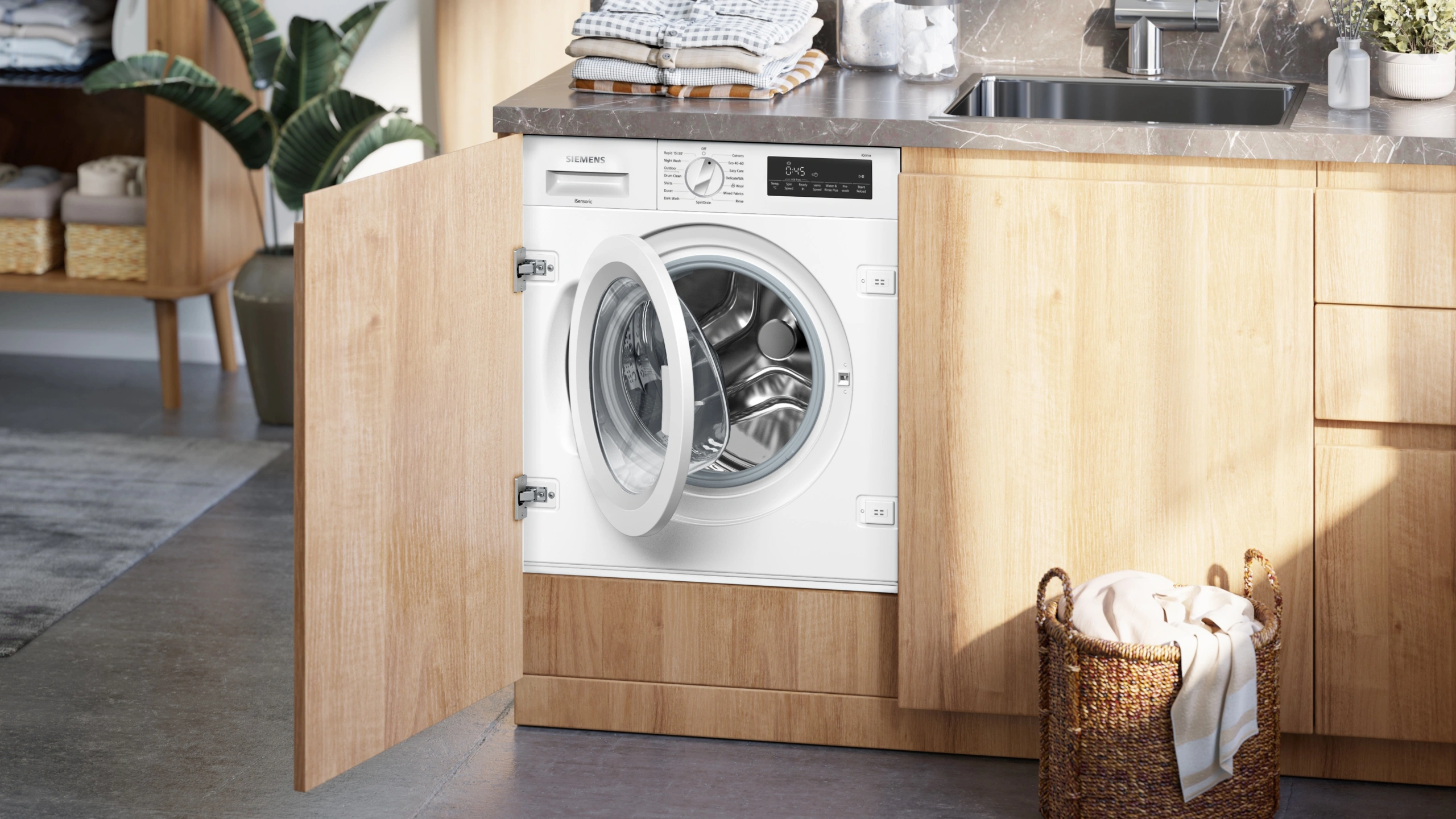 Integrated washing machine within oak kitchen cabinetry