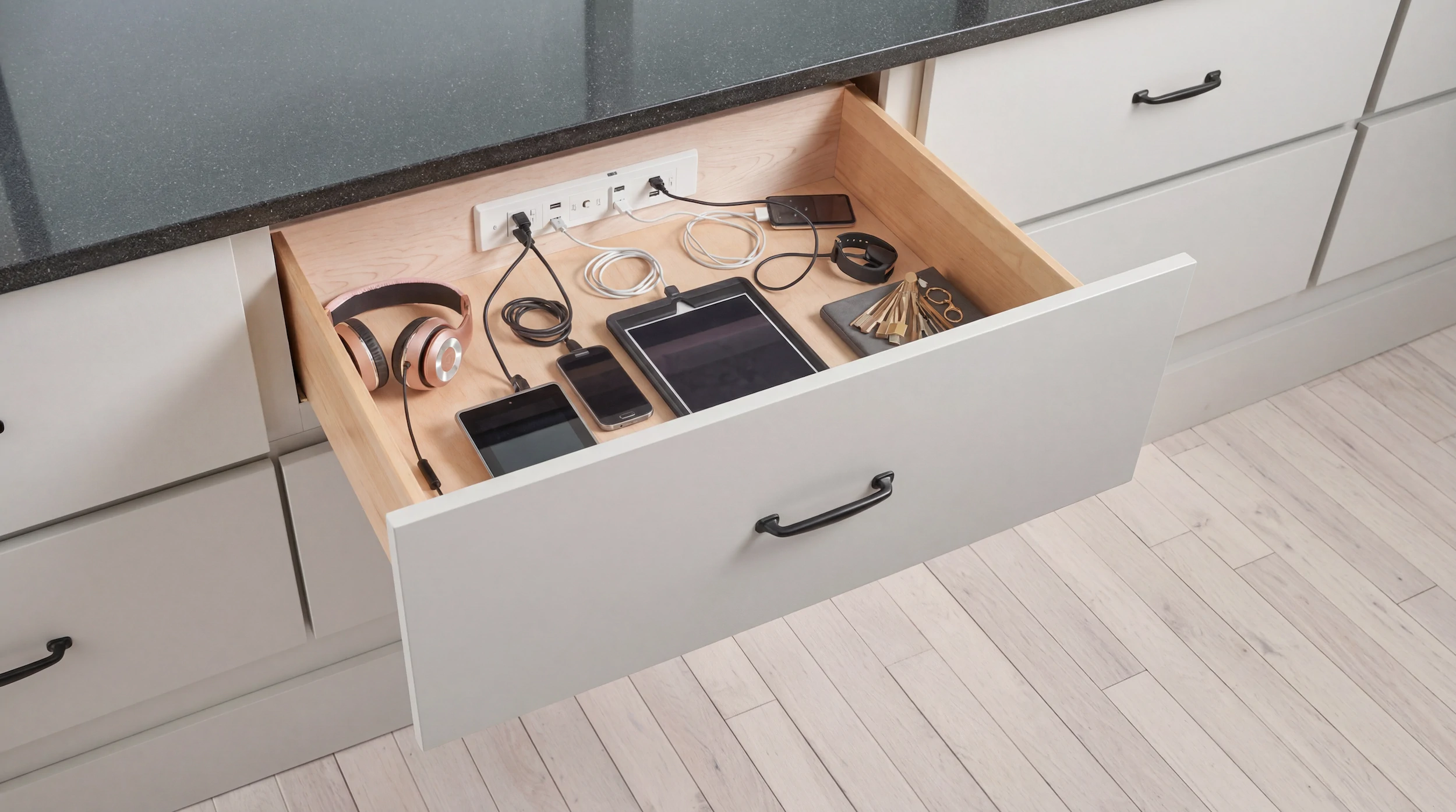 Kitchen drawer with built-in charging sockets and docking station